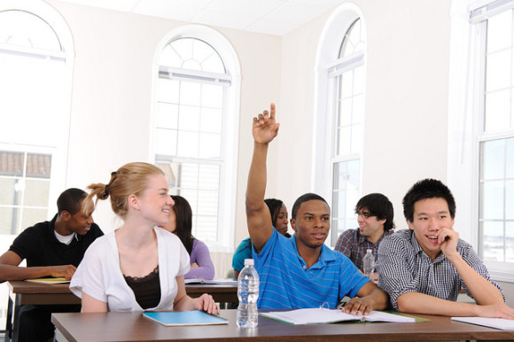 Diverse university students in a classroom.